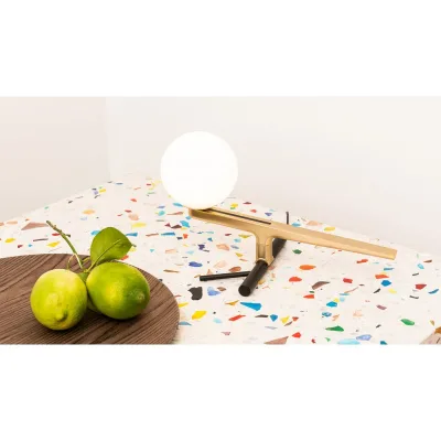 Artemide Lampada da tavolo Yanzi finitura ottone/nero