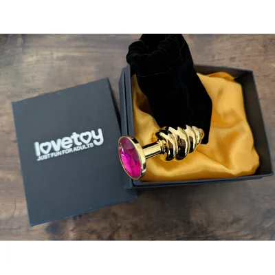 Plug Anale LoveToy metallo pesante color oro gioiello fuxia confezione regalo