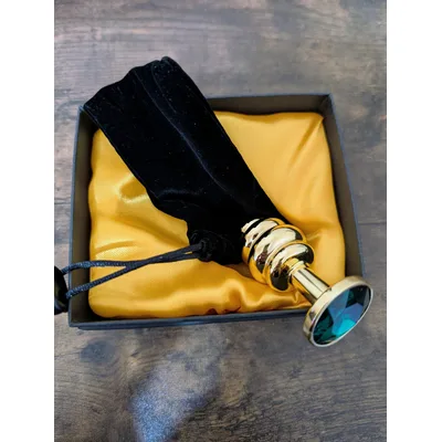Plug Anale LoveToy metallo pesante color oro pietra verde confezione regalo